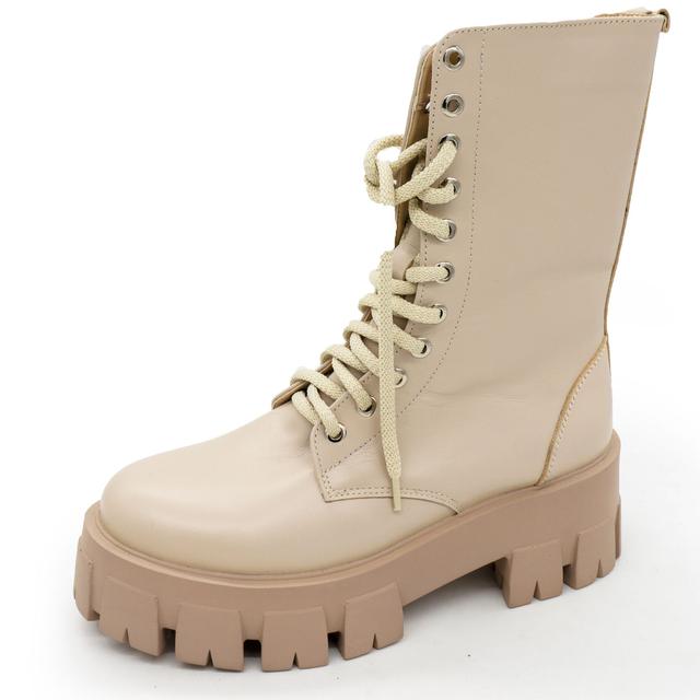 Beige women's winter boots on the platform Dr. Martens