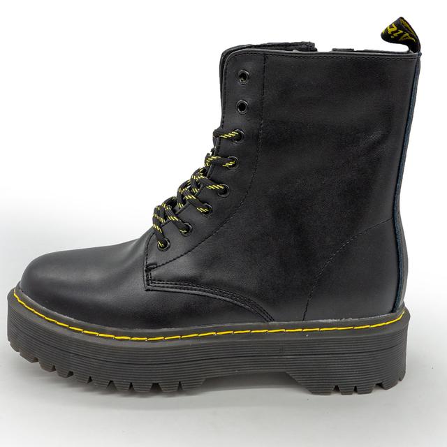 Black women's leather boots with fur in the style of Dr. Martens