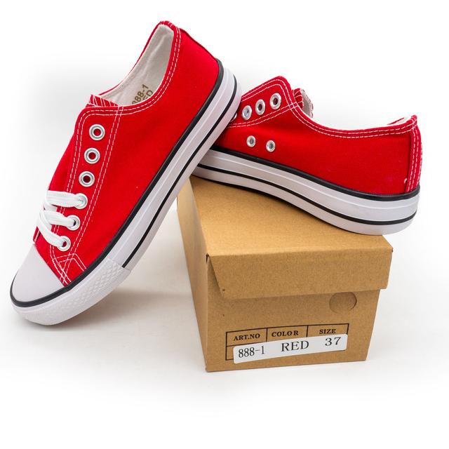 Low-top red sneakers in the style of Converse 888-1