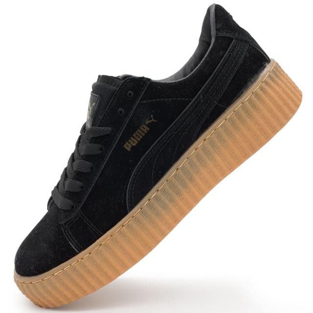 Puma Rihanna women's sneakers are black with a yellow sole