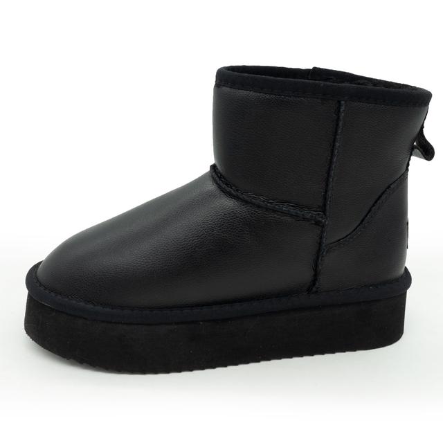 Low winter women's Uggs on a black leather platform