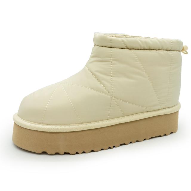 Winter women's beige ankle boots with a high sole